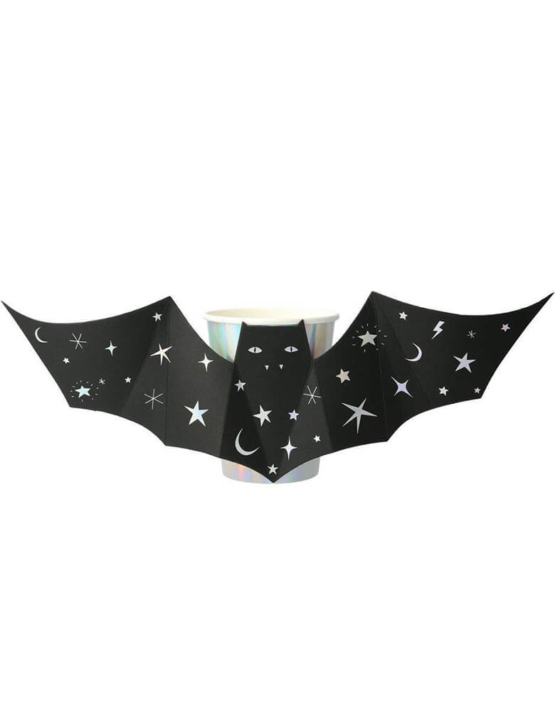 Meri Meri - Sparkle Bat Cups. Set of 8 in 9 oz. These shiny silver holographic cups, featuring black bats with outstretched wings, will thrill and chill your party guests! They are beautifully decorated with shimmering silver stars and moons, and will look amazing on the party table too. 