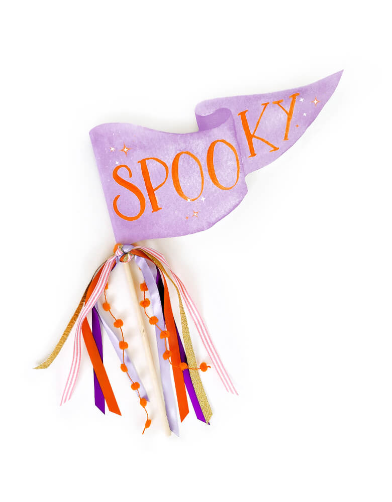 Spooky Pennant by Cami Monet. This 10 x 5 inches handmade pennant featuring a handwriting "Spooky" text in orange color with blinking stars with watercolor background in purple color, on the 120 lb. luxe watercolor texture paper with original illustration for extra whimsy, and with mutily Ribbon and sparkle garland adding details on the rod. This high quality made party pennant is so cute for celebrating Halloween!   Hold it in a photo or pop on a cake or use as your halloween room decoration