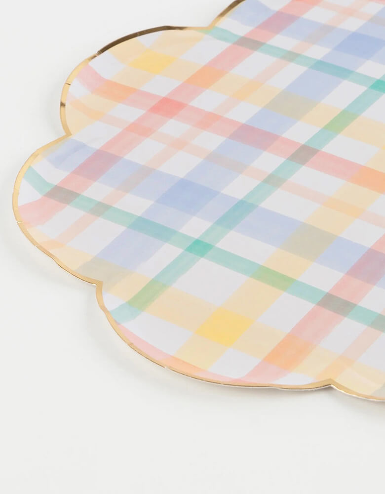 A close-up shot of Momo Party's 10.25" x 10.25" plaid patterned dinner plates by Meri Meri. Add a touch of nostalgia to your party plates with these vintage-inspired plaid designs. They are perfect for any celebration where you want soft muted shades - ideal for baby showers and birthday parties. We love using them for a spring inspired party or an Easter celebration.