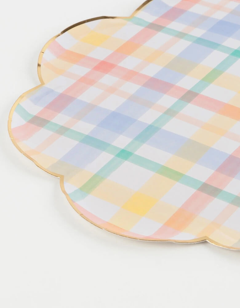 A close-up shot of Momo Party's 10.25" x 10.25" plaid patterned dinner plates by Meri Meri. Add a touch of nostalgia to your party plates with these vintage-inspired plaid designs. They are perfect for any celebration where you want soft muted shades - ideal for baby showers and birthday parties. We love using them for a spring inspired party or an Easter celebration.