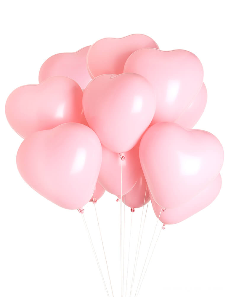Love is in the air with pink Heart Balloons. Studio Pep - Be Mine Heart Balloons. set of 12, 11" diameter pink heart-shaped latex balloons, A sweet touch to celebrate those you love on Valentine's Day, for an anniversary or a shower