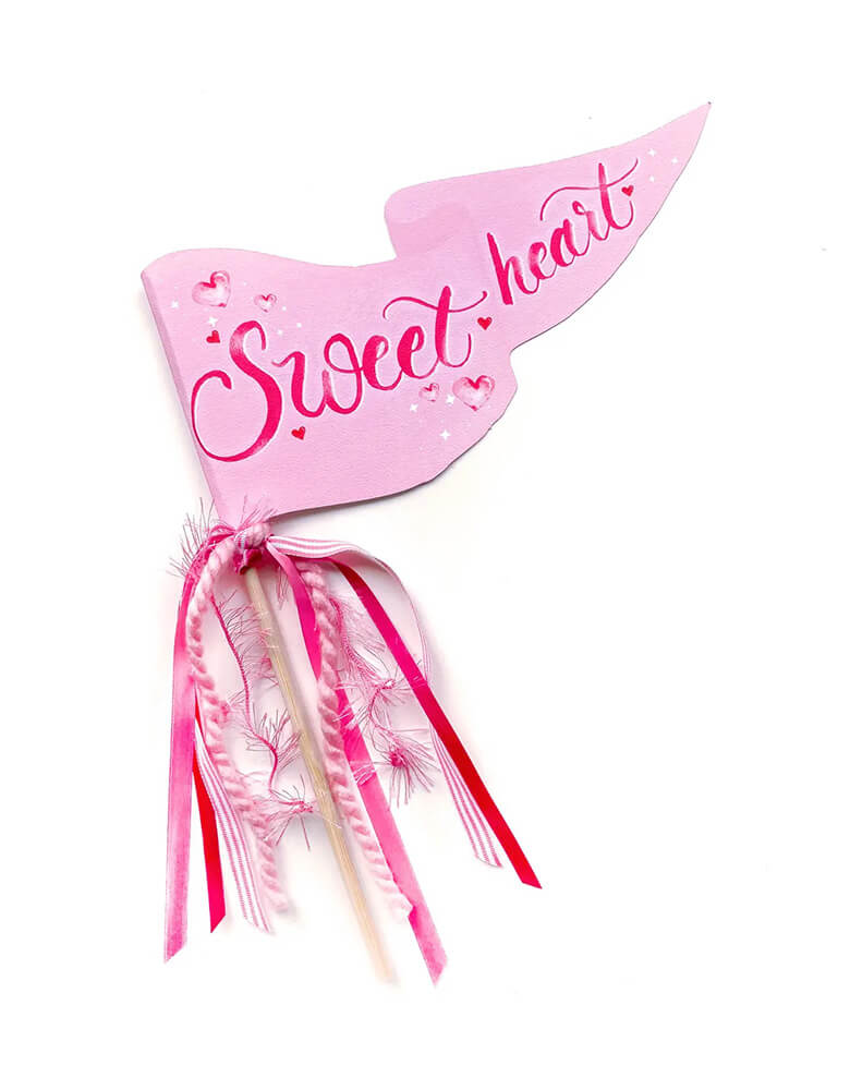 Momo Party's 10 x 5" pink Sweetheart party pennant by Cami Monet. This pink party pennant is made of 120 lb. luxe watercolor texture paper with original watercolor illustration for extra whimsy, with ribbon and sparkle garland. It makes a great decoration for a Valentine's Day party.
