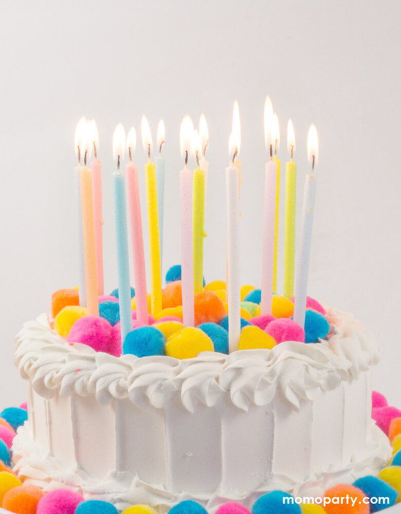 Party Partners - Tall Pastel Rainbow Glittered Candles on the white buttercream cake