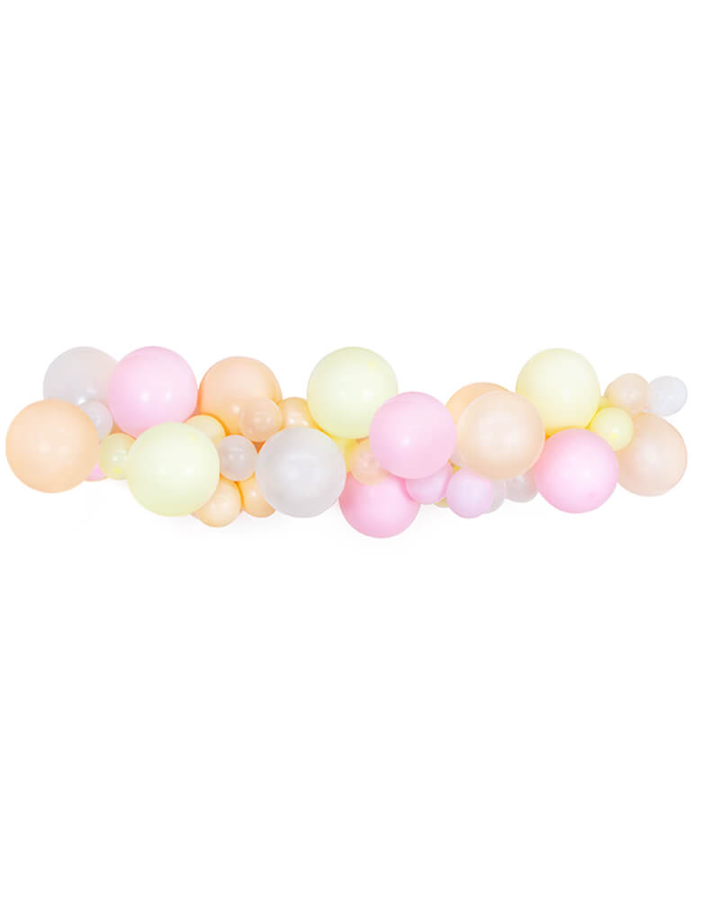 A beautiful pastel balloon garland with light pink, pastel yellow and peach colors