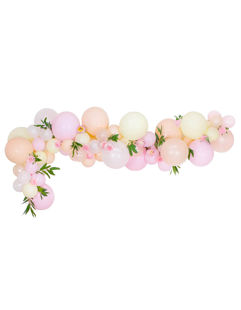 A beautiful pink blush pastel balloon garland with flower decoration
