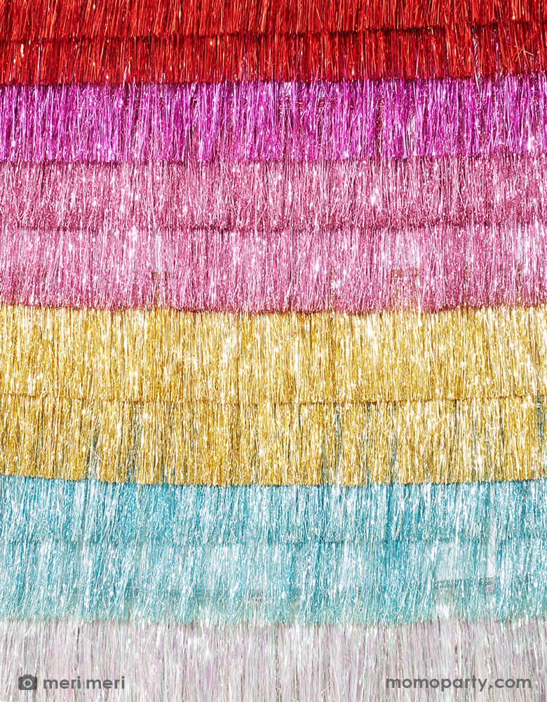 A wall of Meri Meri Colorful Tinsel Fringe Garlands. These gorgeous tinsel garland is perfect to add style and shimmer in seconds. It'll look great at any party or celebration where you want a touch of sparkle. 