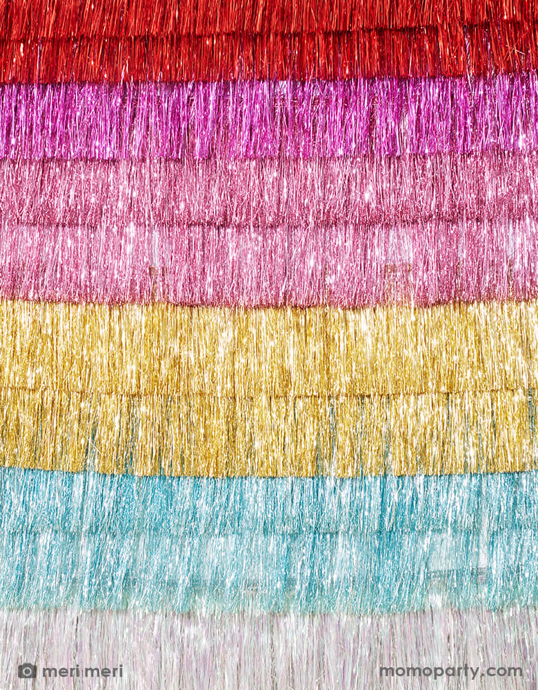 A wall of Meri Meri Colorful Tinsel Fringe Garlands. These gorgeous tinsel garland is perfect to add style and shimmer in seconds. It'll look great at any party or celebration where you want a touch of sparkle.