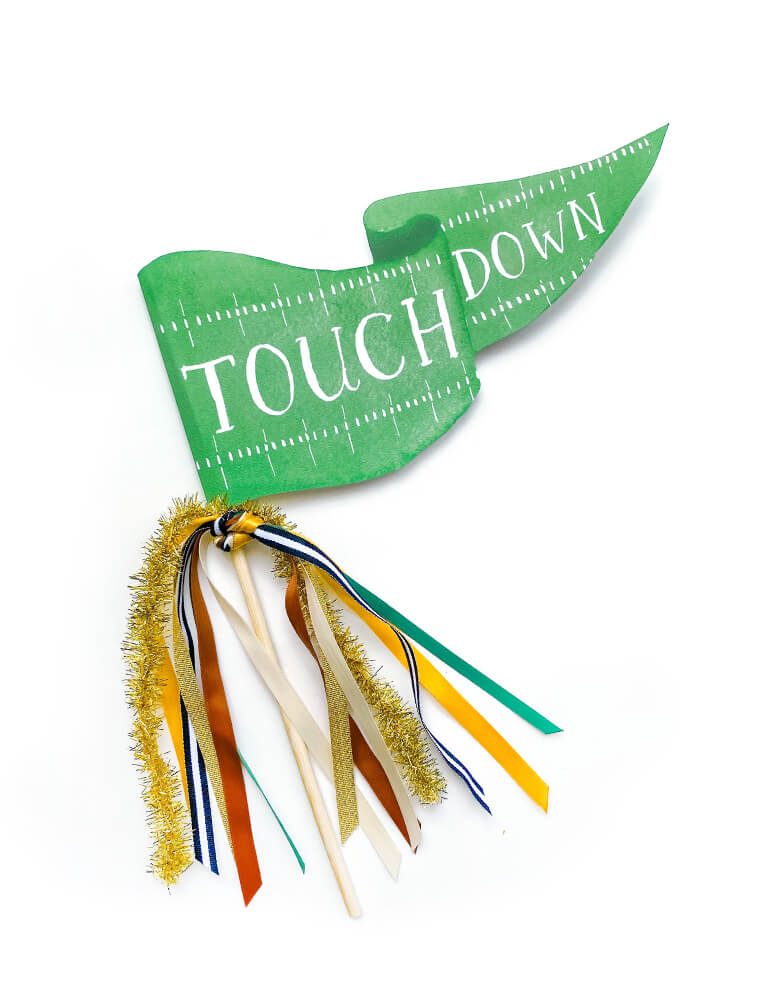 Touchdown Football Tailgate Party Pennant by Cami Monet. This 10 x 5 inches handmade pennant featuring a handwriting white "Touch Down" text with watercolor background in Green, on the 120 lb. luxe watercolor texture paper with original illustration for extra whimsy, and with mutily Ribbon and sparkle garland adding details on the rod. This high quality made party pennant is prefect for celebrating Football party, Super Bowl celebration! Hold it in a photo or pop on a cake or use as cheers to your team