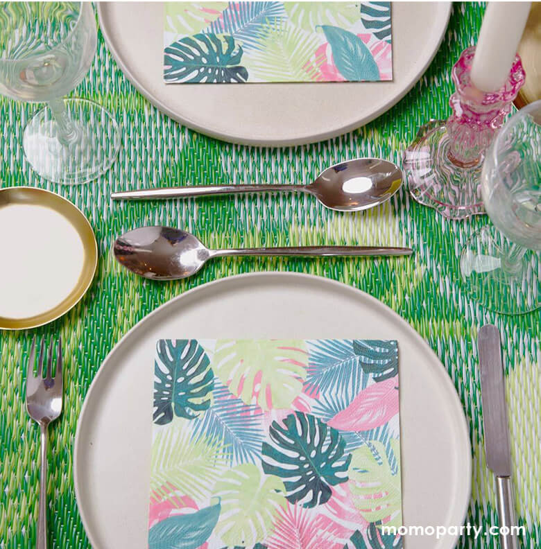 Tropical themed party table look with Fiesta Pink Palm Napkins on top of pink ceramic round plates, with green bamboo table mat. Perfect for a tropical party, summer birthday, picnic, BBQ or garden party!