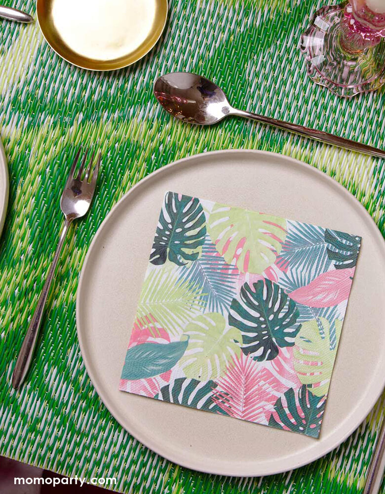 Tropical themed party table look with  Fiesta Pink Palm Napkins on top of pink ceramic round plates, with green bamboo table mat. Perfect for a tropical party, summer birthday, picnic, BBQ or garden party! 