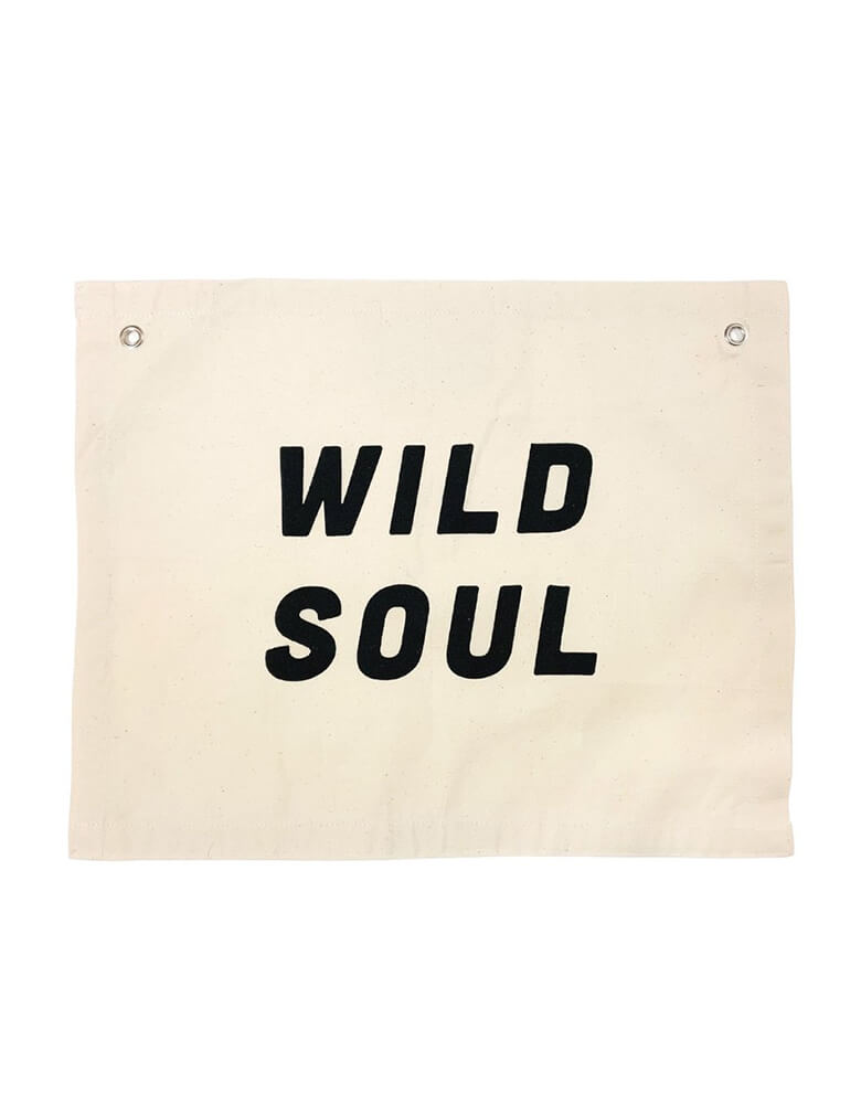 Imani Collective Wild Soul Banner. size 16 x 20 inches with 1/2 inch grommets. This modern hanging banner was sewn and screen printed by hand on natural canvas by local artisans in Kenya. It's a perfect decoration for your entrance hall, Nursery Decor, or your little wild one's playroom, unique birthday gift for a wild one. Sold by Momo party store provided modern party supplies, boutique party supplies, chic holiday party supplies and high end party supplies
