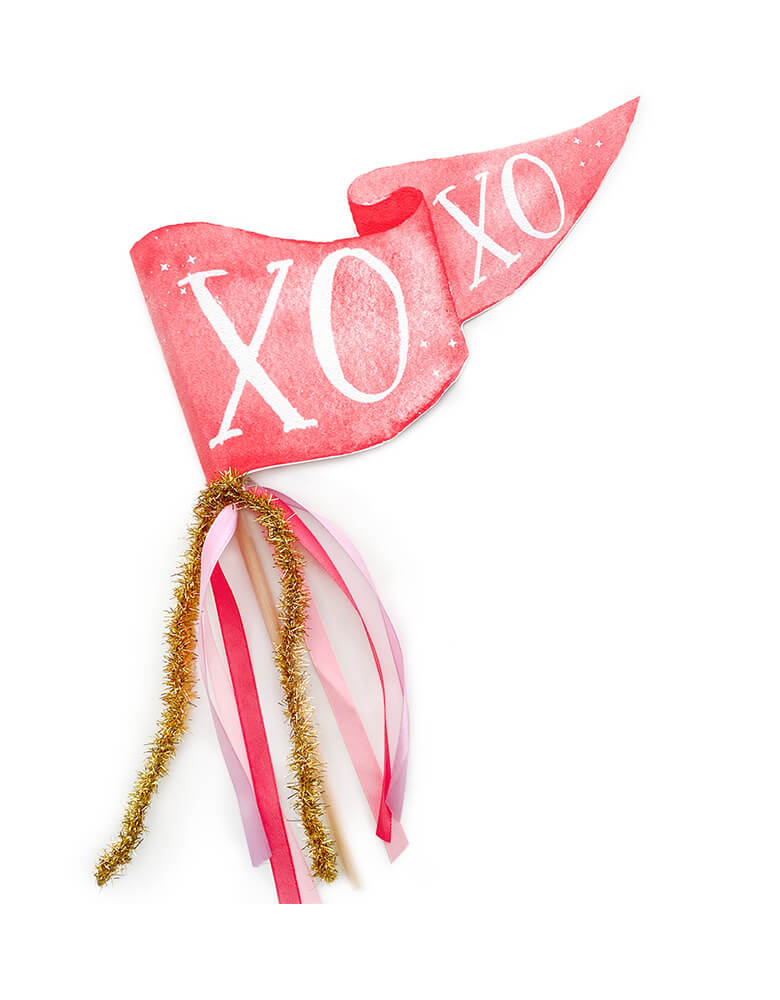 Cami Monet - XOXO Party Pennant. This Handmade pennant made in United States of America, in Size: 10 x 5 inches. This is made of 120 lb. luxe watercolor texture paper with handwriting "XOXO" text in watercolor illustration for extra whimsy. With pink and red and gold mixed Ribbon and sparkle garland. This adorable party pennant is a perfect for a sweet Valentine's Day celebration!