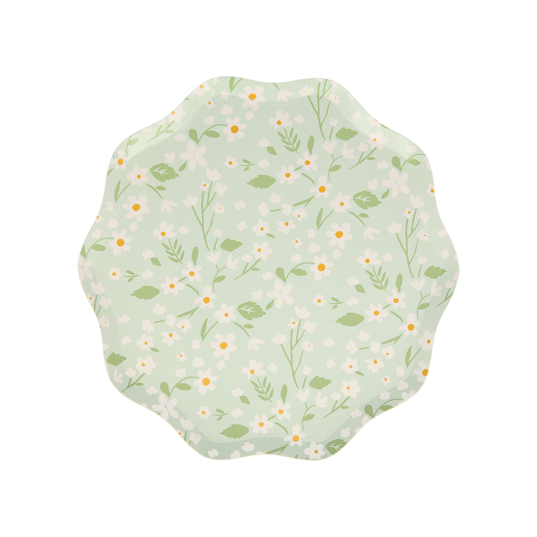 Ditsy Floral Side Plates By Meri Meri. Features a fabulous floral pattern with a stylish scalloped edged in green color designed paper plates. Made from eco-friendly paper. Add a touch of springtime beauty to your party table with these high quality, well designed party plates.