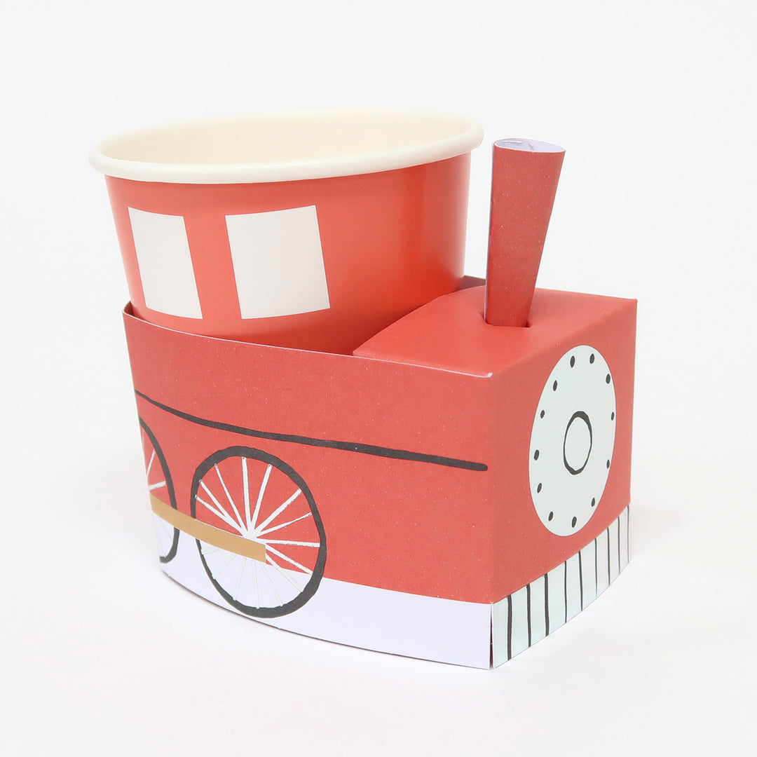 Momo party 3D Train cups by Meri Meri ,  9 oz. cup in red, they're perfect for kid's birthday party. Simple self assembly required. Cups are made of 3 easy-to-assemble pieces - cup, cup wrap and funnel